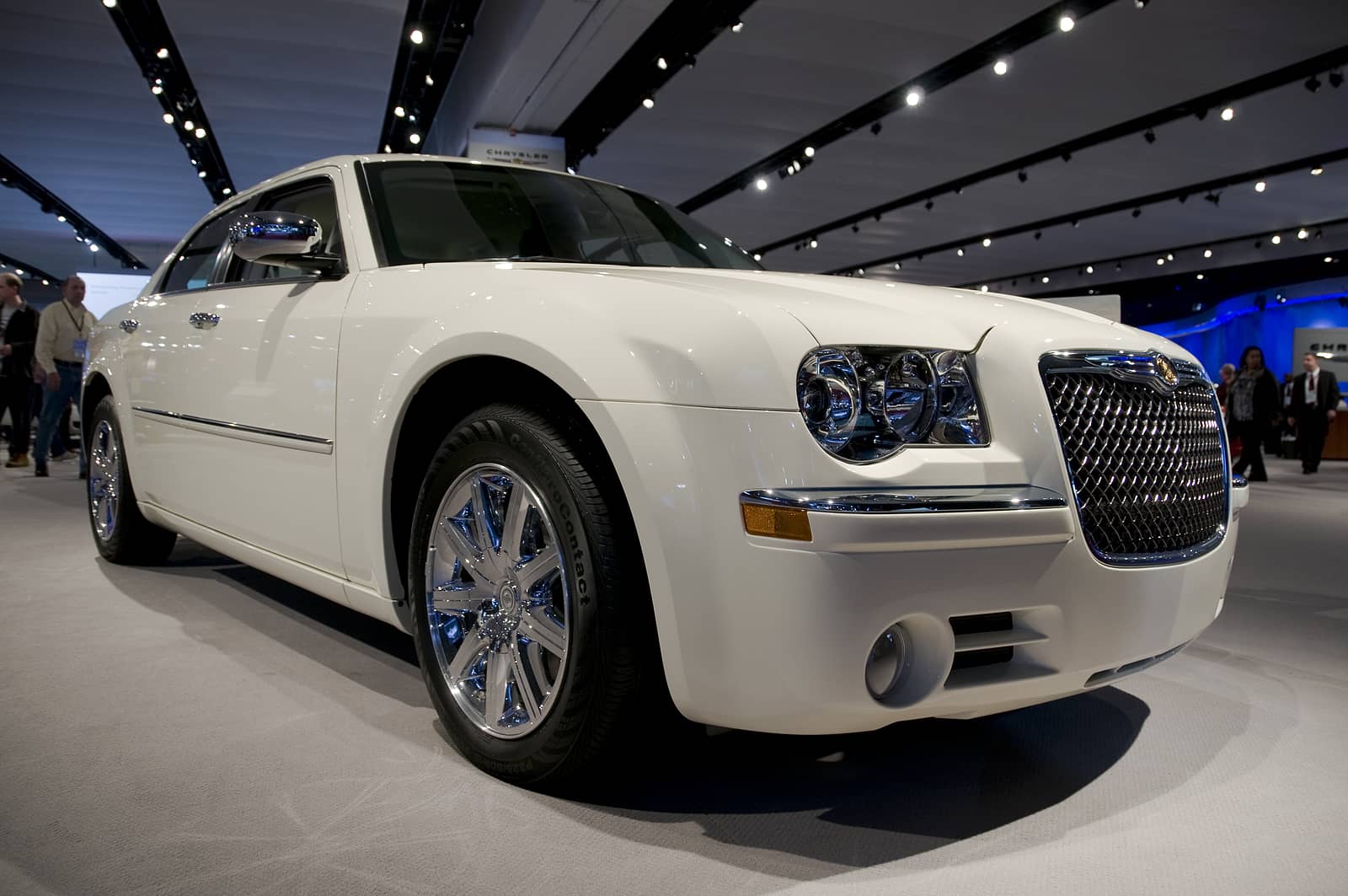 Locksmith Chrysler – Professional Chrysler Locksmith Services in Madison – A white Chrysler sedan displayed at an auto show, representing expert Chrysler key replacement, lockout services, and ignition repair by Kwik Pick Locksmith Service.